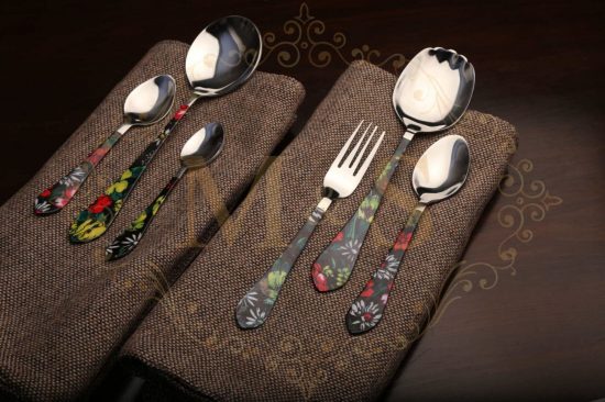 Complete aura fortune thunder cutlery set placed on brown cloth.