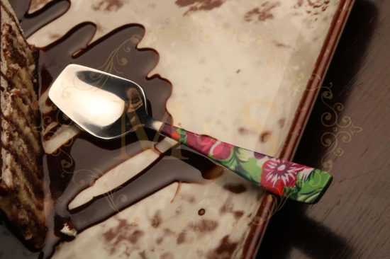 Dessert spoon with chocolate dessert.